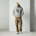 Man wearing a  grey Skull Print Hoodie